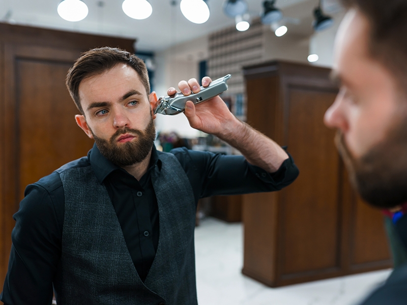 Man using a beard trimmer